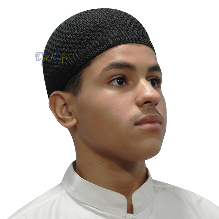 Black knitted Islamic kufi cap with a breathable mesh pattern from TheKufi.com.