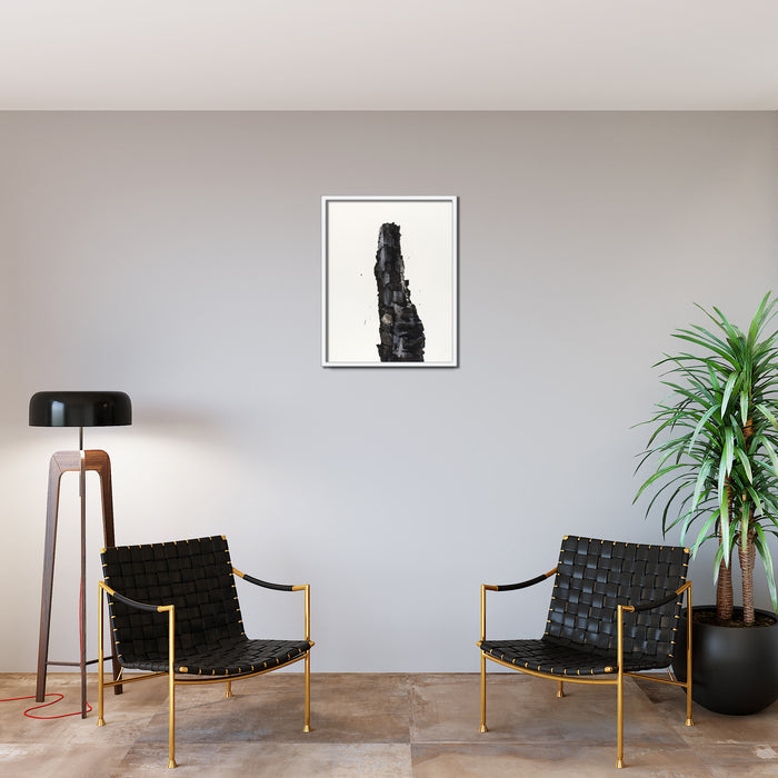 The artwork 'Burnt Wood' by Theresa Bloise features a dramatic vertical black brushstroke against white paper, suggesting charred timber rising from flames. The bold acrylic strokes create intense texture and movement, with splattered details adding depth and rawness to the 30x22 inch abstract composition. Floating in a minimalist white background, the piece captures the essence of destruction and resilience.