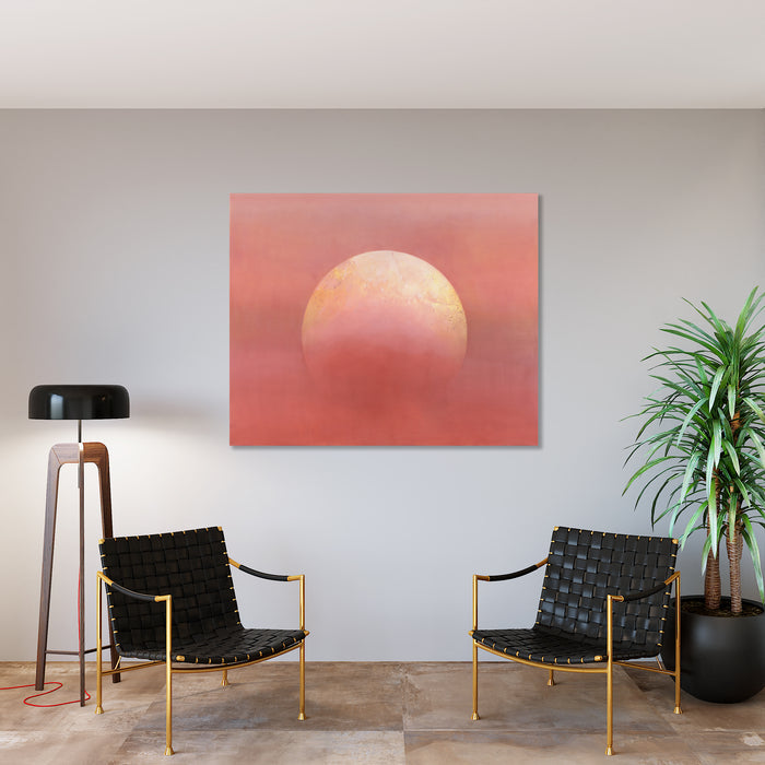 The artwork 'Butter Moon' by Theresa Bloise features a luminous, ethereal full moon in warm butter-yellow tones against a dreamy coral-pink sky. The abstract celestial composition, rendered in oil and acrylic on canvas, creates a serene atmospheric effect with subtle textural gradients blending from peach to rose hues. The large-scale painting measures 53.5 x 65.5 inches.