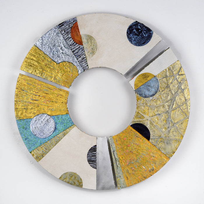The artwork 'Convex #35' by Francie Hester features a circular composition with abstract geometric elements, combining vibrant gold sections with turquoise accents and metallic silver details. Textured spherical forms in navy blue, black, and neutral tones float across the segmented aluminum surface, created with acrylic and cold wax technique.