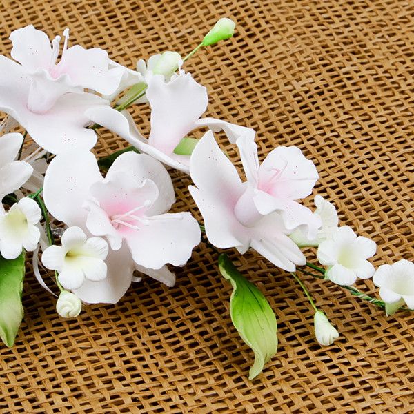 Cooktown Orchid Sprays in Pink are gumpaste sugarflower cake decorations perfect as cake toppers for cake decorating fondant cakes and wedding cakes. Caljava wholesale cake supply.