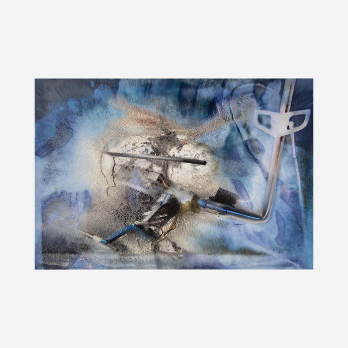 The artwork 'Crash in Blue' by Sarah Canfield features dynamic abstract composition with watercolor-like blue washes surrounding a central metallic silver burst. Dark gestural marks and textural elements create depth against ethereal blue backgrounds, while mixed media techniques on panel add dimensional complexity. 18x24 inches mixed media artwork by Sarah Canfield.