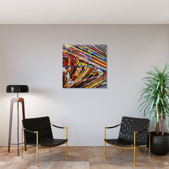 The artwork 'Flooding 2' by Sabrina Puppin features dynamic diagonal brushstrokes in vibrant colors including orange, red, blue, and yellow, creating a sense of explosive movement. The synthetic glazes on canvas produce a glossy, textured effect with intersecting linear patterns that radiate outward in a burst of abstract energy. 40x40 inches. By Sabrina Puppin