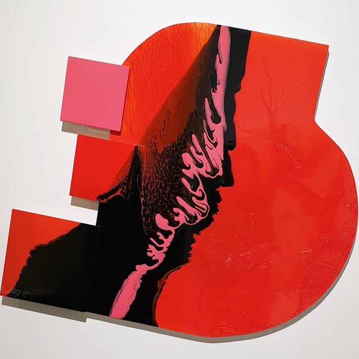 The artwork 'Is It Real or Am I Dreaming 3' features bold geometric shapes in vivid red with a dramatic black diagonal slash accented by pink flowing patterns. The composition on wood showcases glossy synthetic glazes creating a dynamic contrast between sharp edges and organic forms. This contemporary abstract piece measures 47x55 inches by Sabrina Puppin.