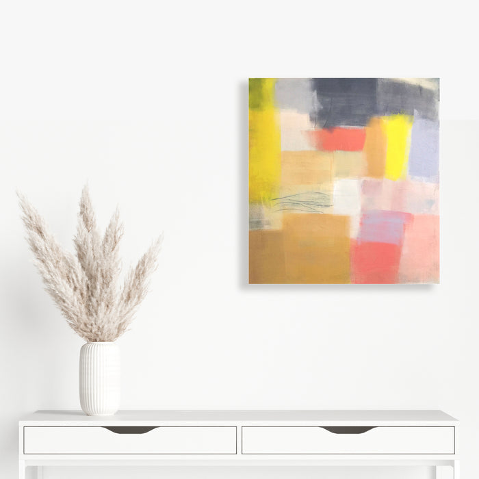 The artwork 'Mid Century 1' by Ellen Hermanos features an abstract composition with bold geometric blocks in coral pink, golden beige, and bright yellow tones, accented with cool greys. The 28x26 inch acrylic painting displays soft brushstrokes and layered color transitions, creating a modern, atmospheric effect characteristic of mid-century abstract expressionism. Art by Ellen Hermanos.