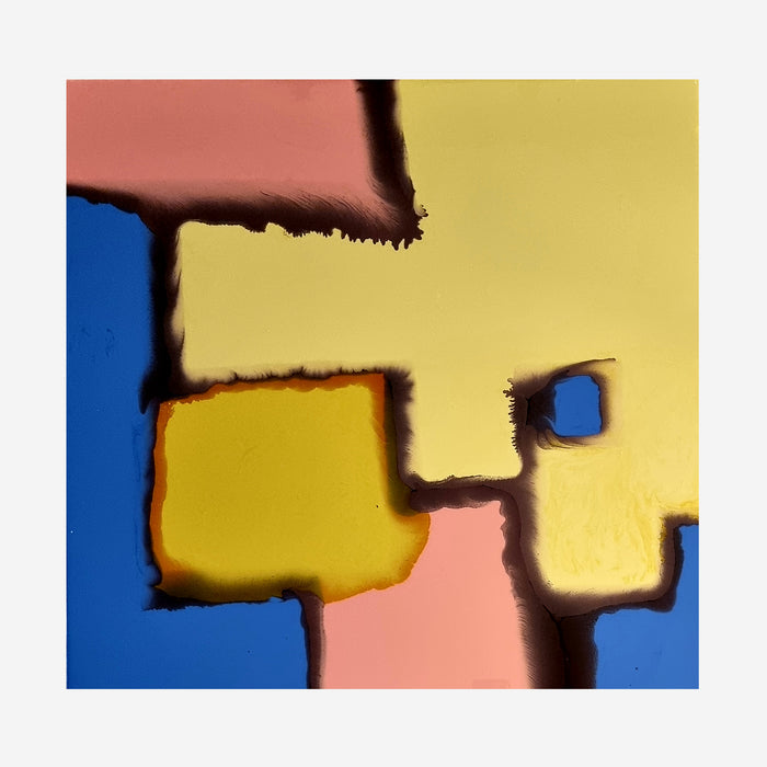 The artwork 'Thawed Geometry' by Sabrina Puppin features abstract geometric shapes in bold primary colors - cobalt blue, yellow, and salmon pink. The composition showcases soft-edged blocks creating an engaging puzzle-like pattern, with dark shadow-like borders blending the transitions between shapes. The synthetic glazes on canvas create a luminous, modern aesthetic that combines hard-edge abstraction with subtle color gradients.