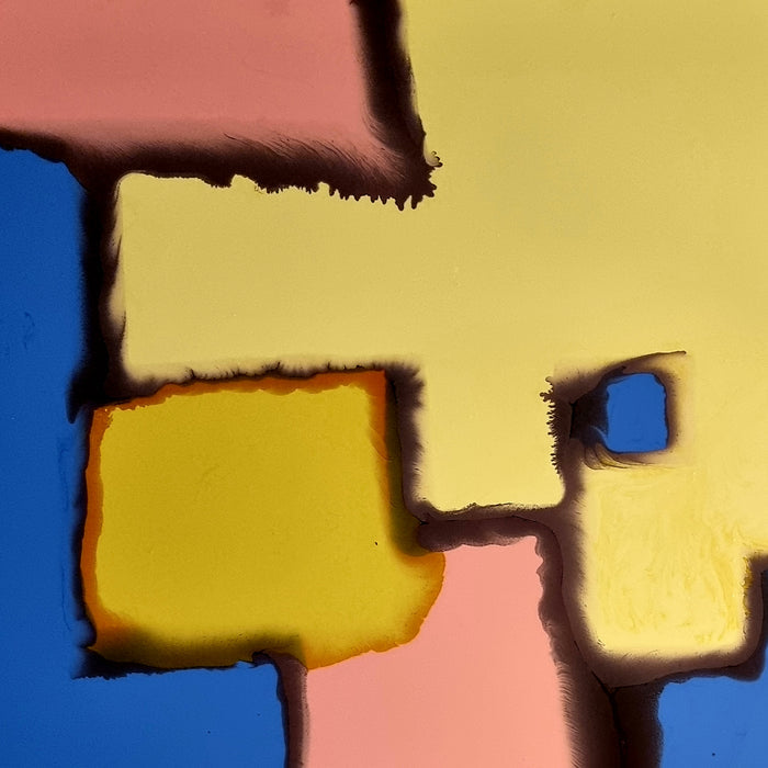 The artwork 'Thawed Geometry' features bold geometric shapes in vibrant colors including cobalt blue, sunny yellow, and soft pink, with dark contrasting edges creating a puzzle-like composition. The synthetic glazes on canvas create smooth color transitions and textured boundaries, expressing abstract modernist style. By Sabrina Puppin.